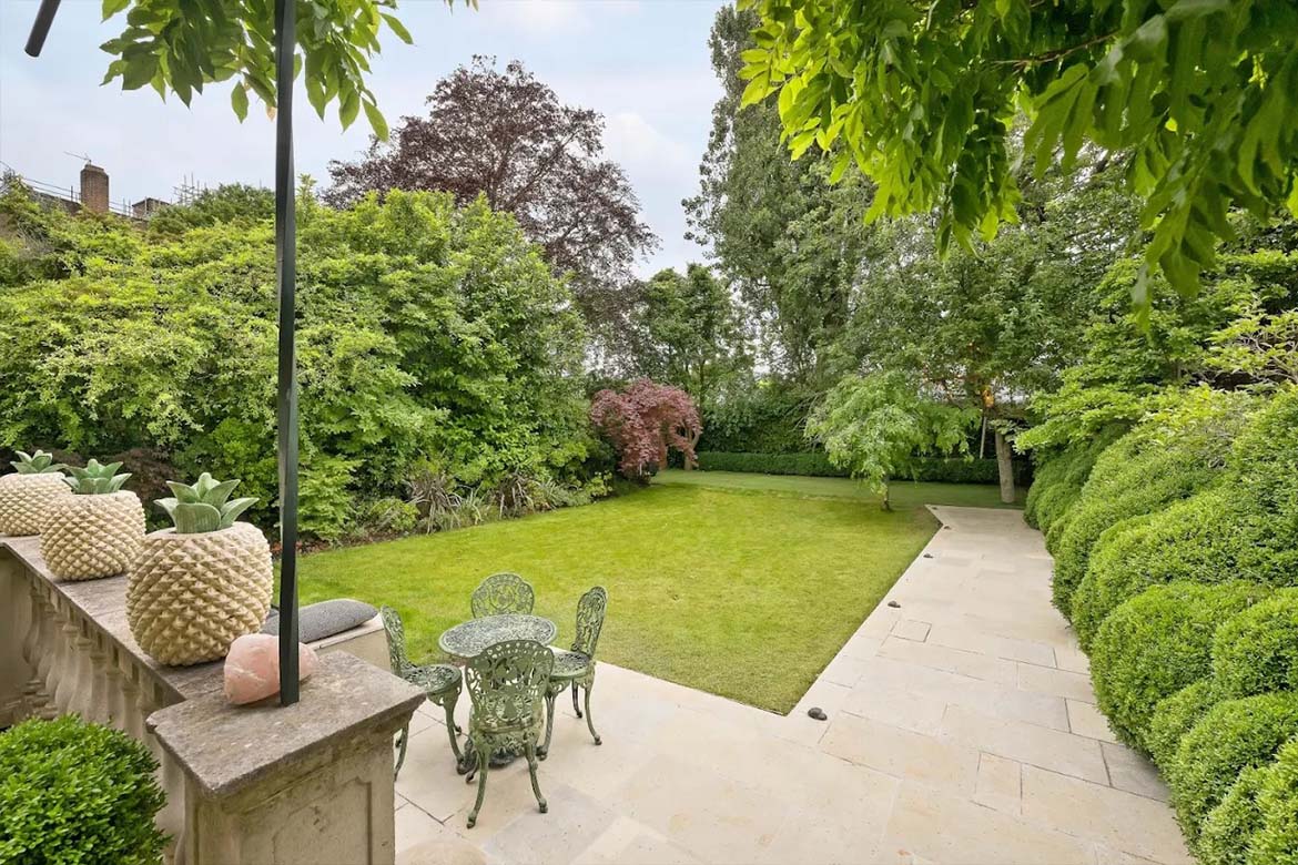 This house on Marlborough Place is not only an example of exquisite design but also reflects the high standards of living offered by Dendynamics. Every detail has been thoughtfully crafted with care for comfort and functionality, creating ideal conditions for a modern family.  Architectural Features The exterior of the house draws attention with its elegant façade, which harmoniously blends into the surrounding landscape. The use of natural materials and large windows ensures not only a stylish appearance but also maximizes natural light inside. The roof with wide overhangs and balconies creates a cozy atmosphere and allows for enjoying views of the garden.  Interior Inside, the house exudes warmth and comfort. Spacious rooms are decorated in neutral tones, creating a sense of lightness and airiness. High ceilings and an open layout provide freedom of movement and a feeling of space. The kitchen, equipped with modern appliances and a large island, is perfect for family gatherings and celebrations.  Garden and Outdoor Spaces The expansive garden, surrounded by tall trees, offers not only privacy but also countless opportunities for active recreation. Here, one can host picnics, grow vegetables and flowers, or simply enjoy reading a book outdoors. The barbecue area and a relaxation zone with a gazebo create ideal conditions for summer parties with friends and family.  Amenities and Technology Modern technologies integrated into the house ensure comfort and security. Smart systems for managing lighting, heating, and security allow homeowners to control all aspects of their home right from their smartphones. Additionally, the house is equipped with ventilation and air conditioning systems, guaranteeing a pleasant microclimate at any time of the year.  Uniqueness and Connection to Dendynamics The presence of such a home in the Dendynamics portfolio underscores the company’s high standards in design and construction. This house is not just a residence; it embodies the concept of modern living, where technology, comfort, and style come together in a cohesive space.  This house on Marlborough Place is a place where one can not only live but also create unforgettable memories with family and friends, savoring every moment of life in one of the most beautiful corners of London.
